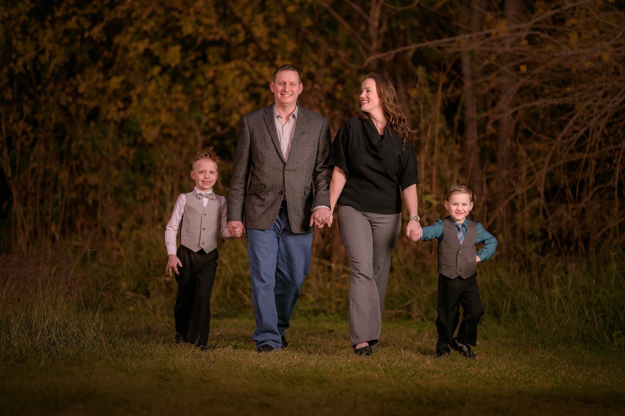 Family with two boys photo walking in park