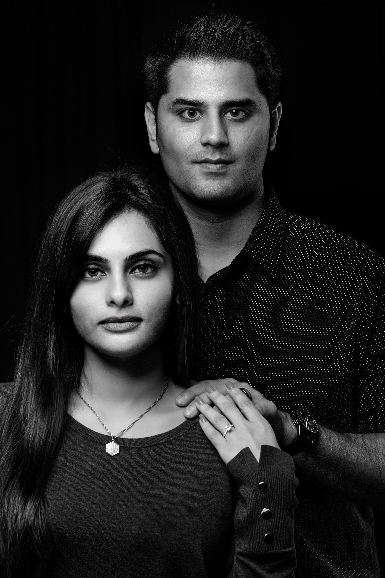 black and white, arranged indian engagement, dramtic moody portrait