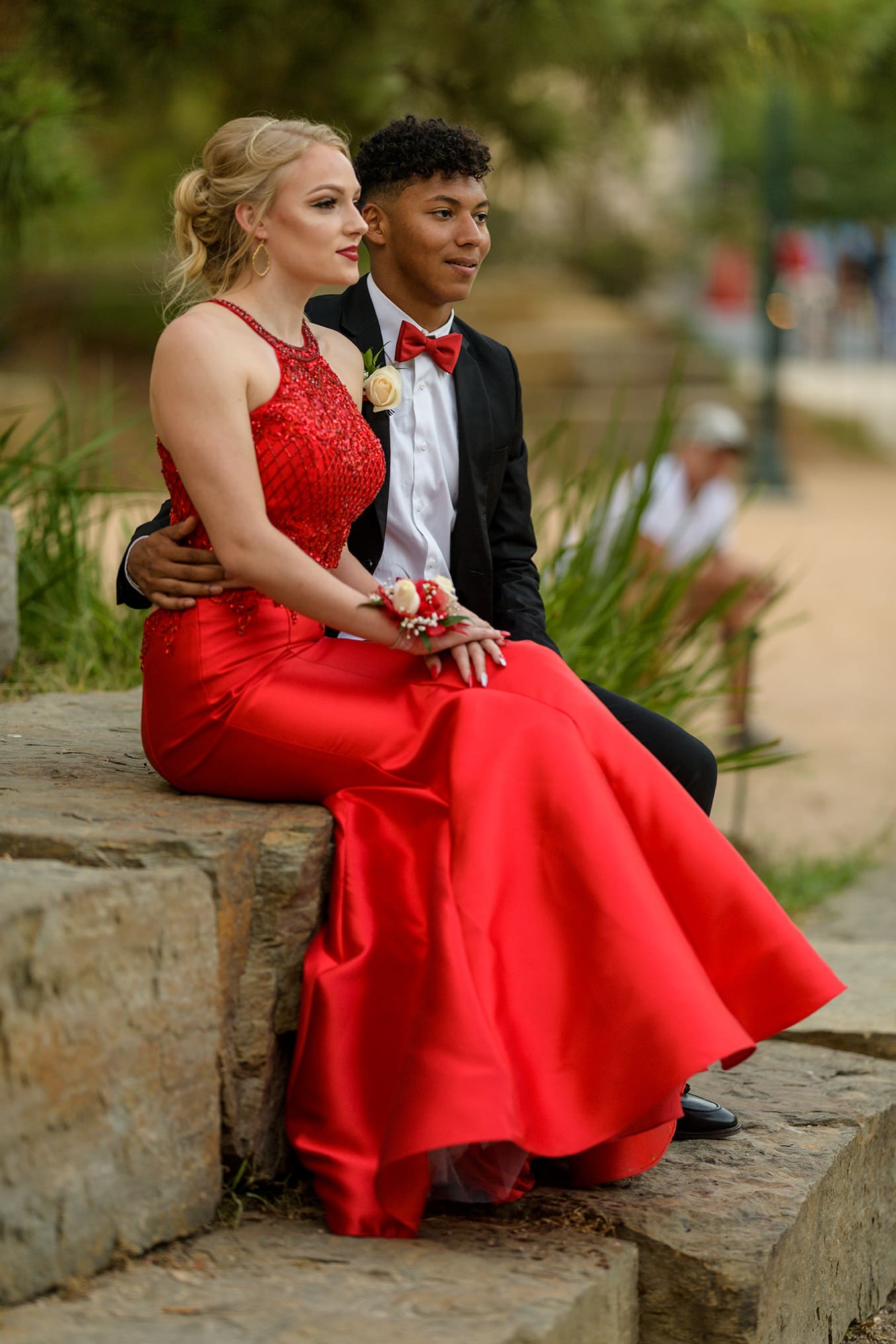 prom couple pose on rocks at herman park houston texas