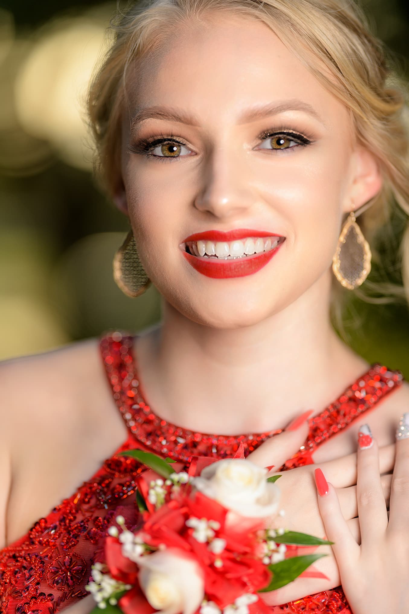 blond prom girl nails red dress sparkles bokeh