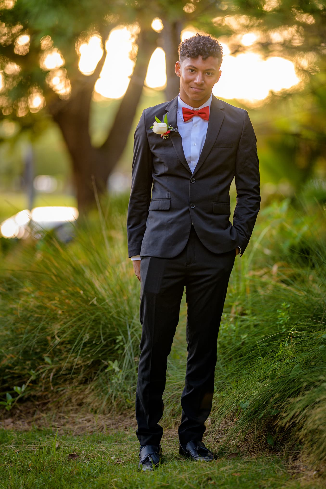 prom date red bow tie and boutonniere sunset golden hour