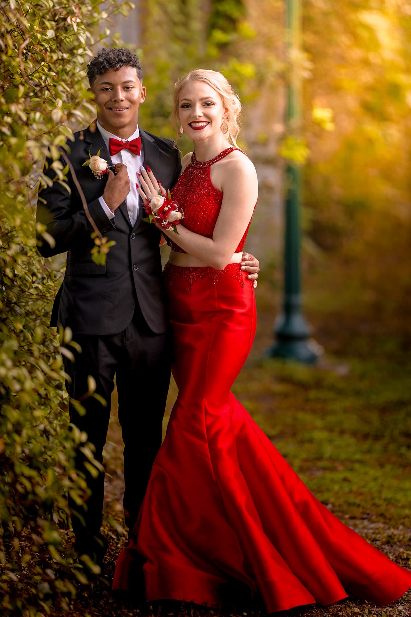 Premium Photo | A young couple poses for a photo in their prom dress.