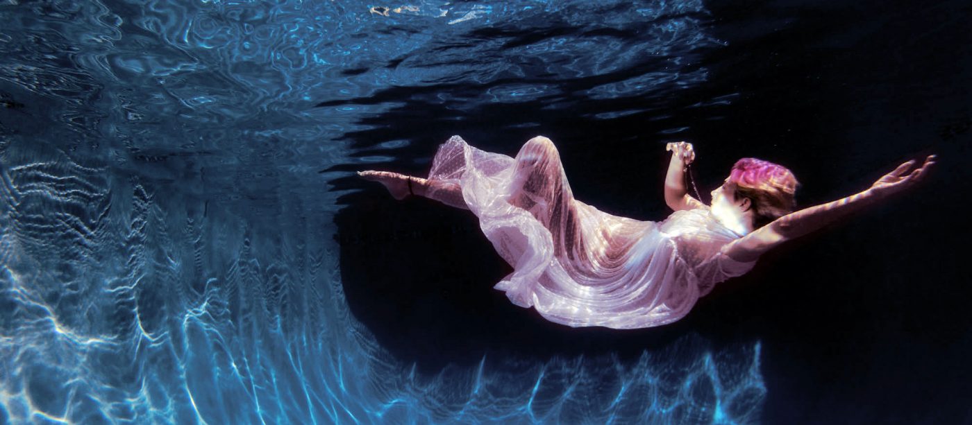 underwater, white sheer dress colorful hair, floating
