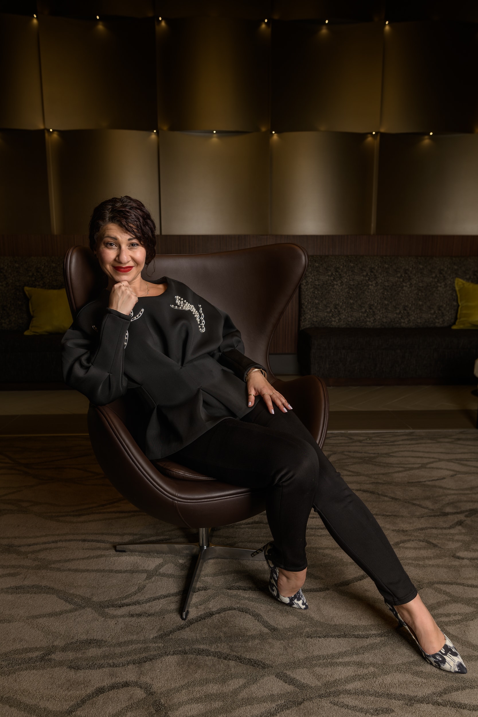 Sahar CEO power portrait leather chair metallic walls