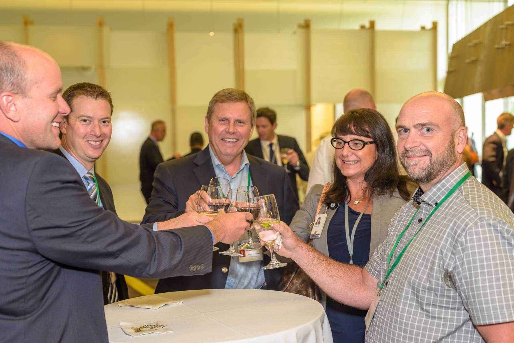 group of workers cheers a drink