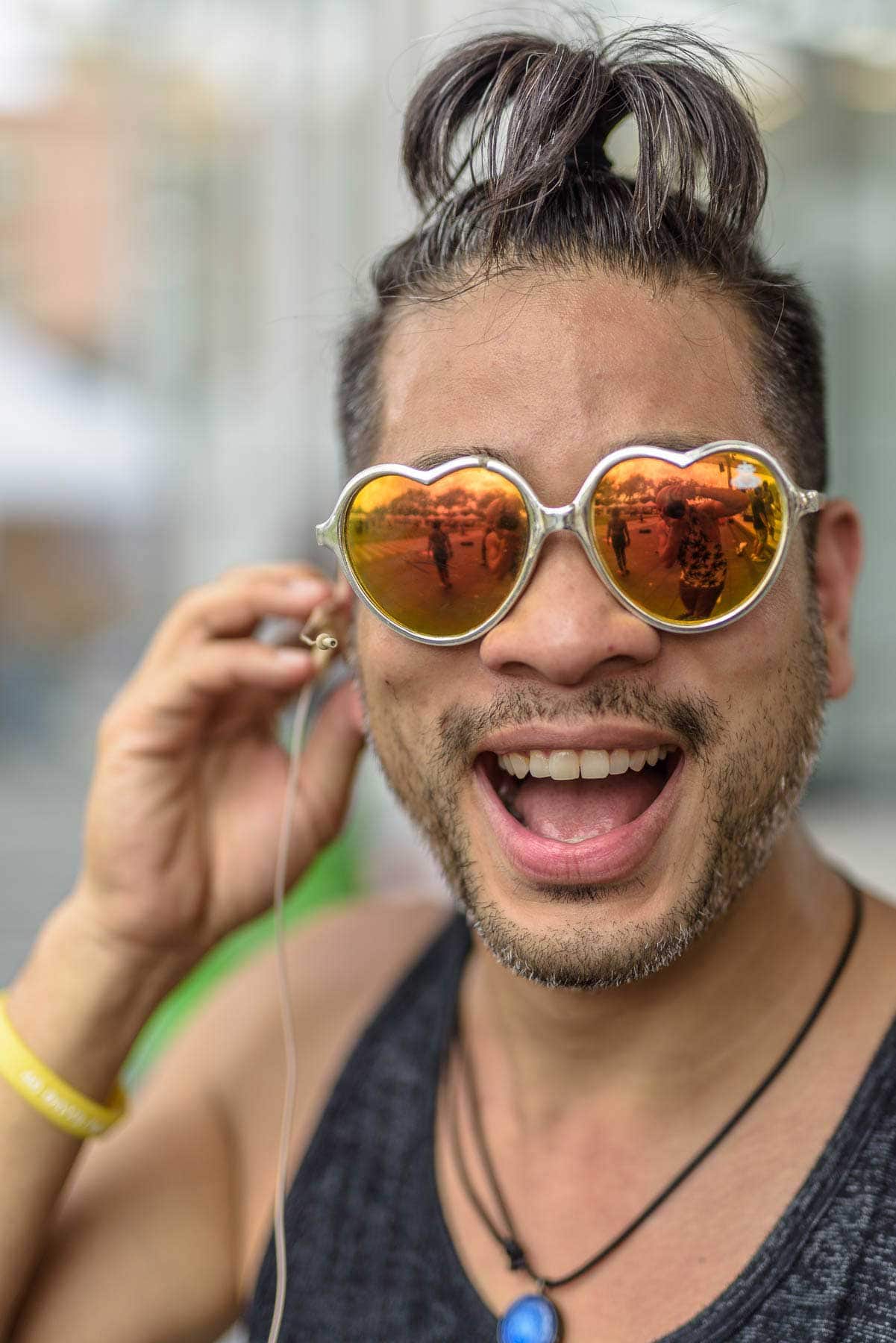 John Tran poses at a festival while Dj