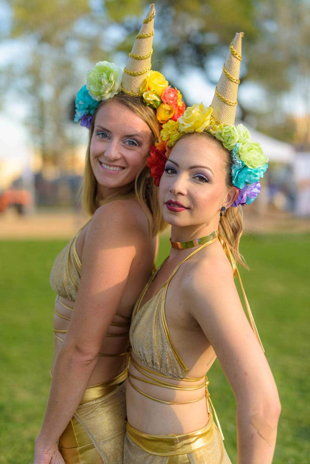 two women unicorns at a festival