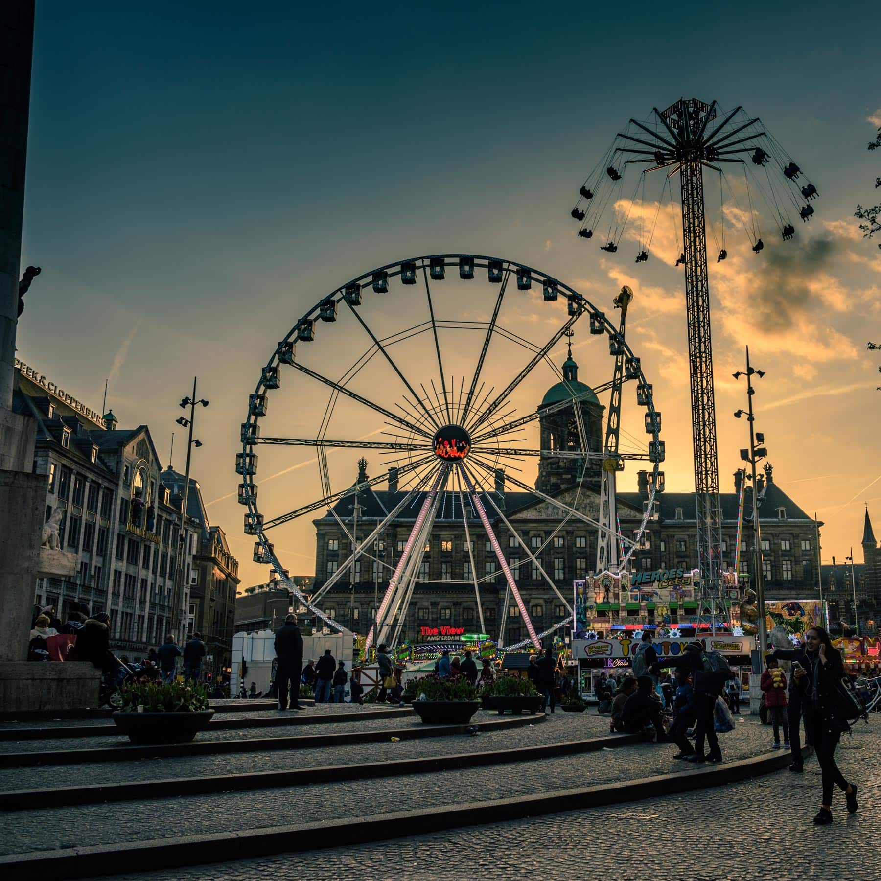 A ferris wheel in the middle of a city.