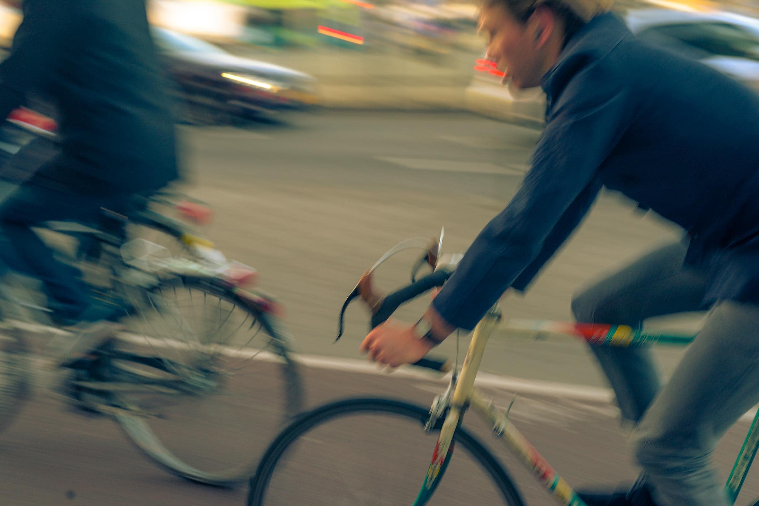 A man, clad in a sporty outfit, pedals rhythmically on his sleek mountain bike. His cheeks are flushed with the exertion and wind blowing against his face as he maneuvers through gentle slopes and sharp turns. His eyes spew an exhilarating mix of determination and unmatched joy - pure adoration for this liberating activity. The wheels spin relentlessly on the smooth pavement, every rotation echoing the consistency of his effort. Breaking free from worldly constraints, he conquers distances while serenely becoming one with nature- a sublime sight to behold indeed.