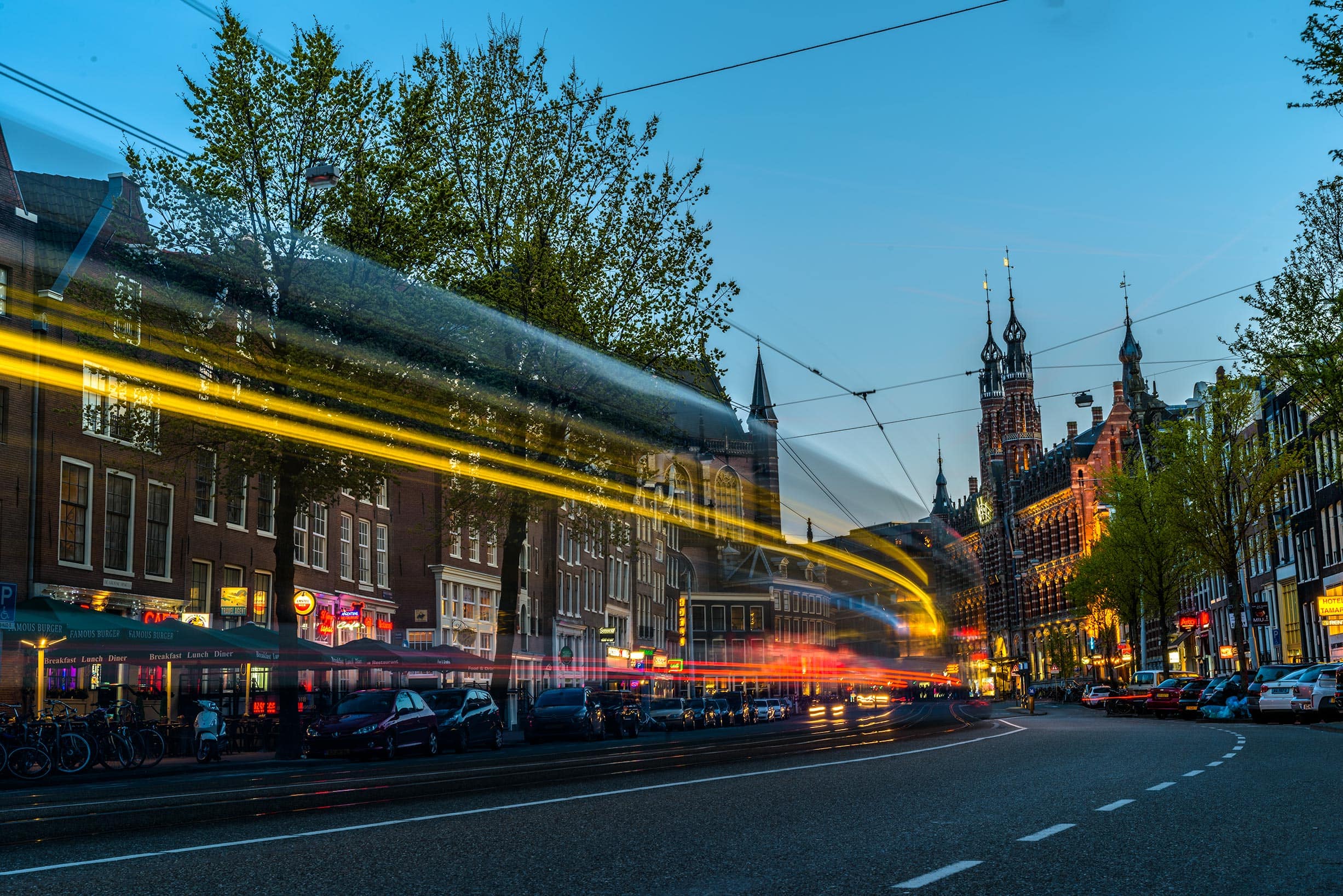 A yellow bus driving down a street.