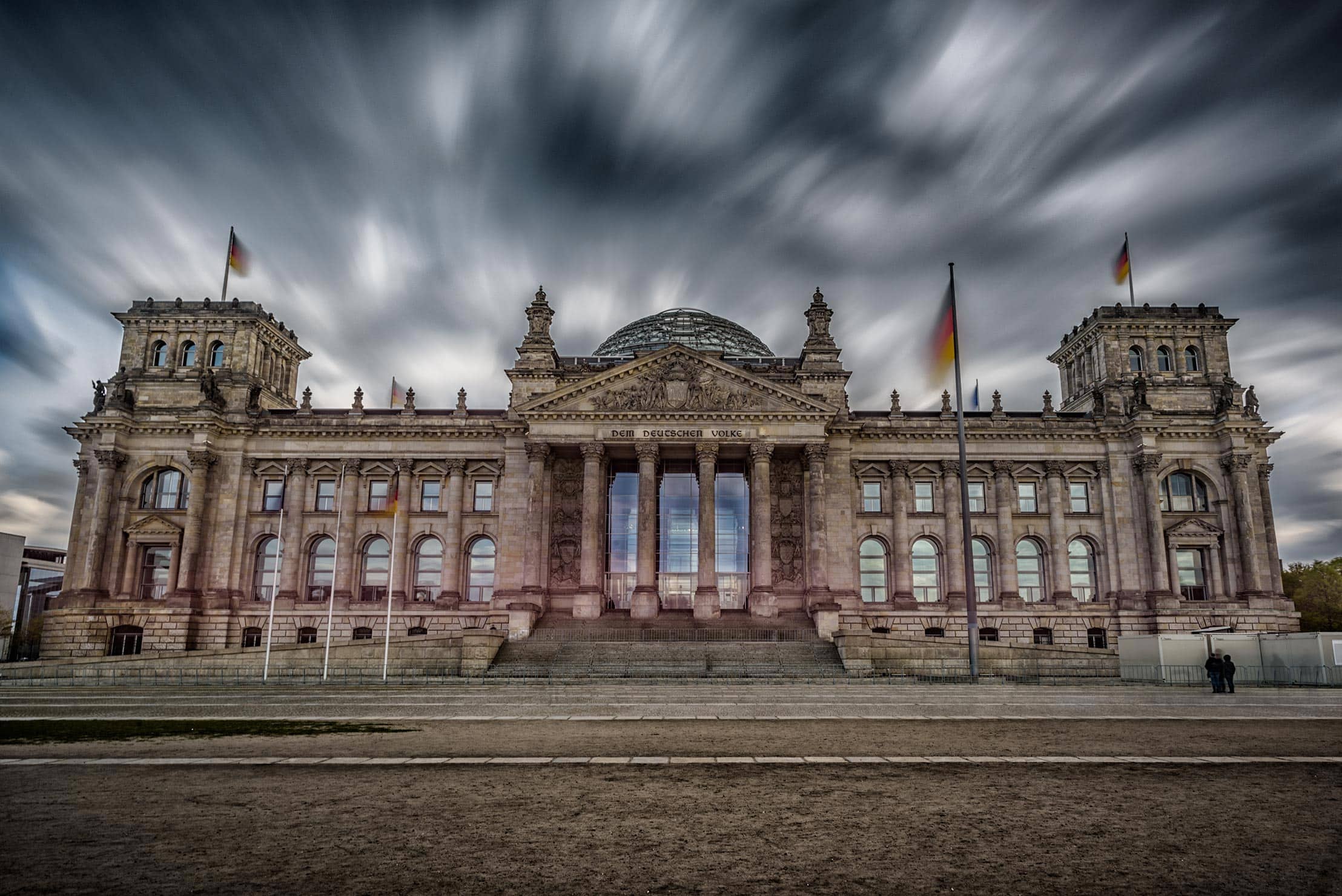 An image of the reichstag building with a cloudy sky.