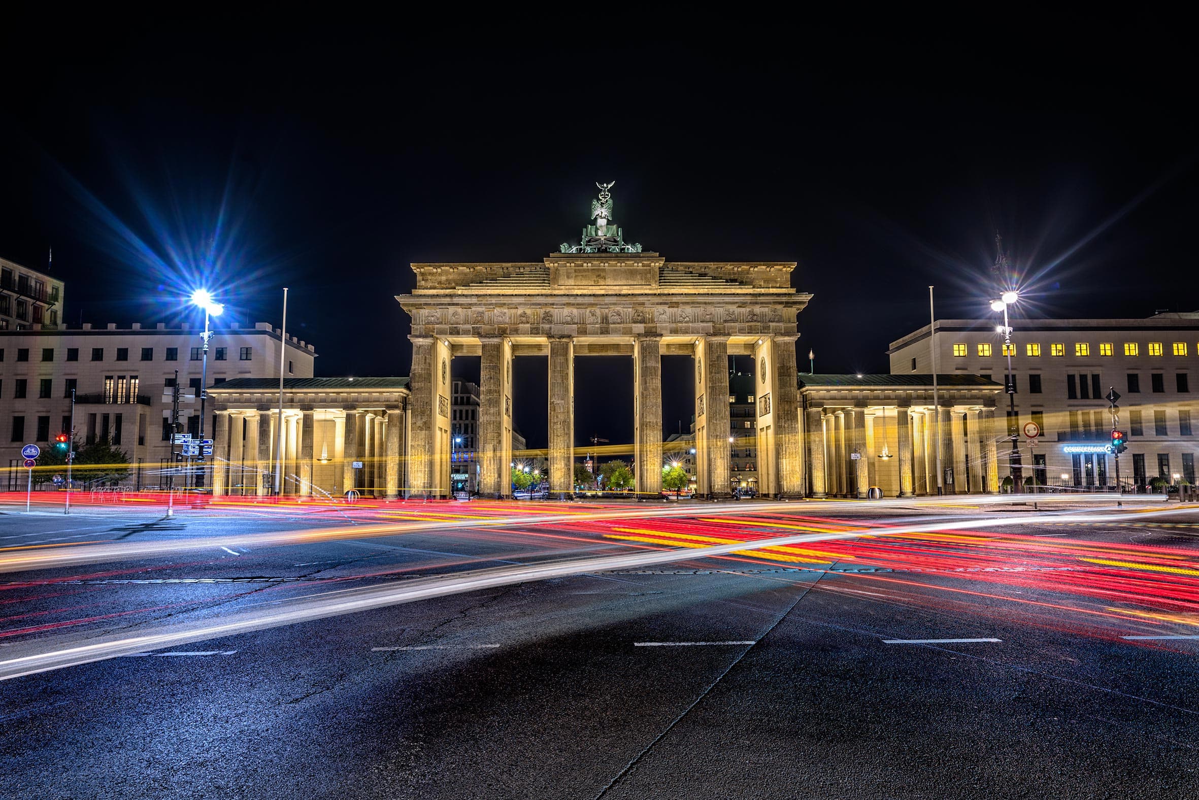 Brandenburg Gates of Berlin with light streaks at night