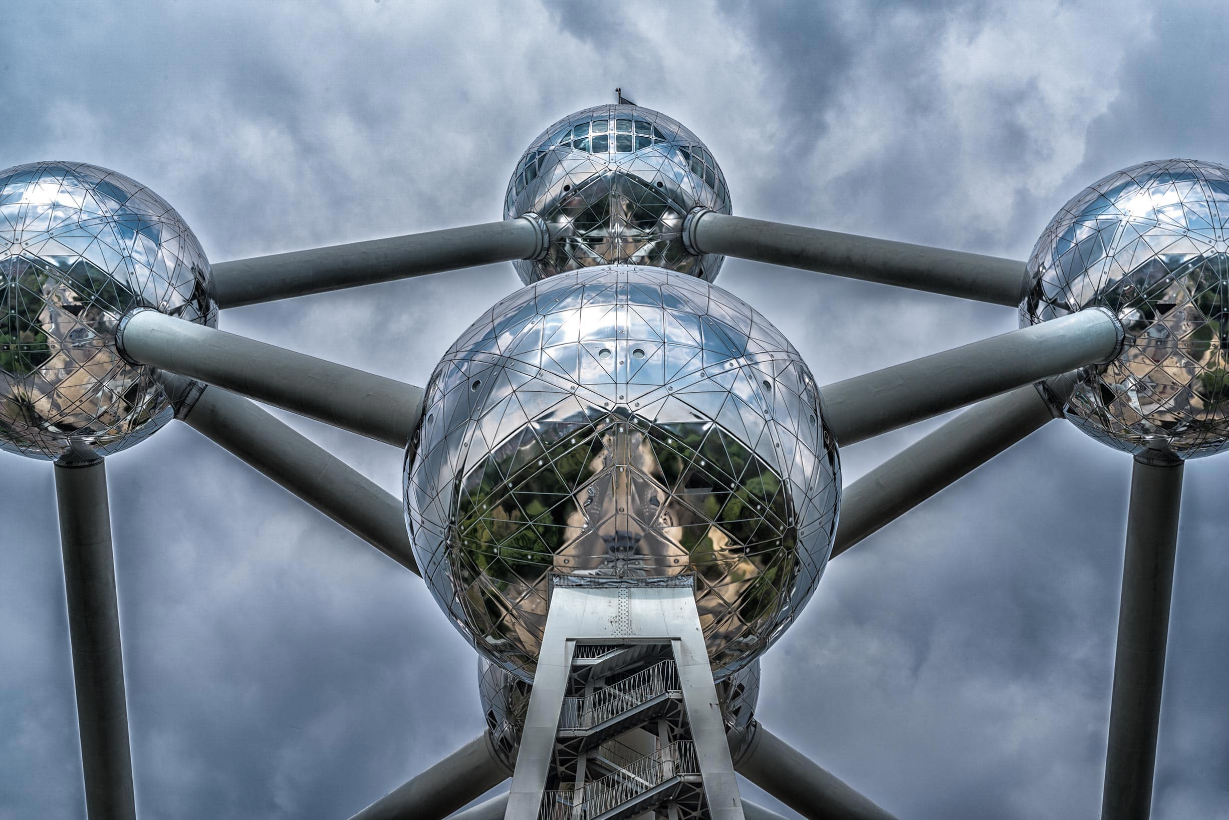 A group of mirrored balls on top of a building.