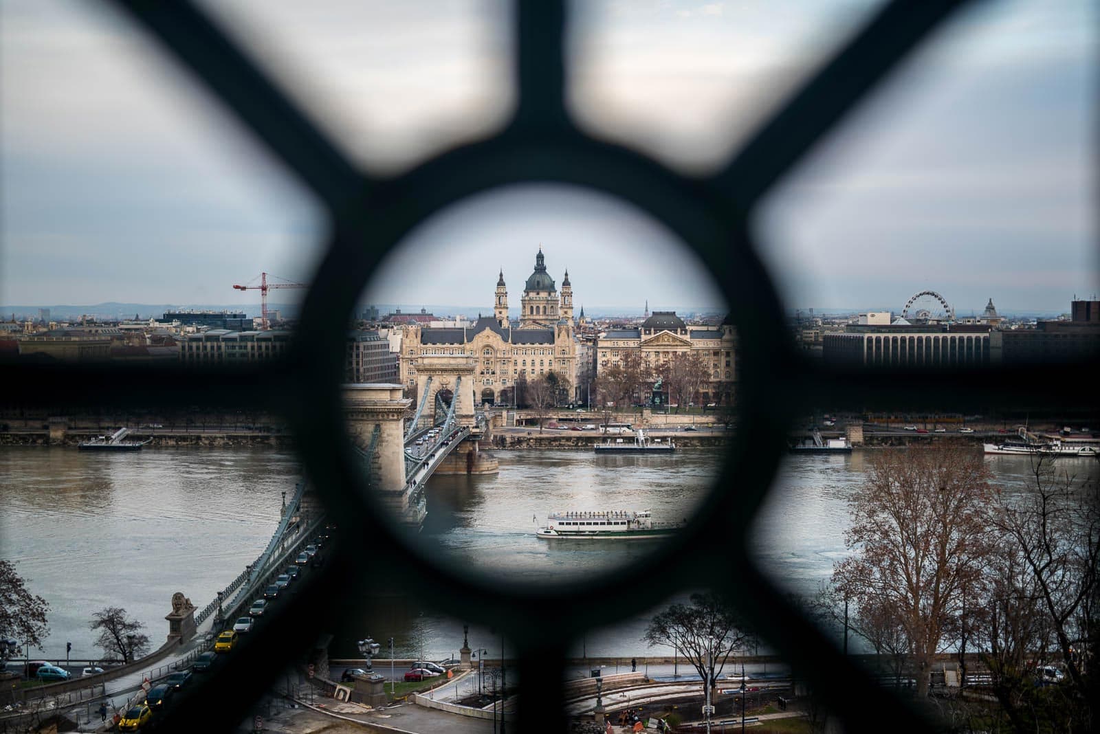 A view of the danube river through a window in budapest, hungary.