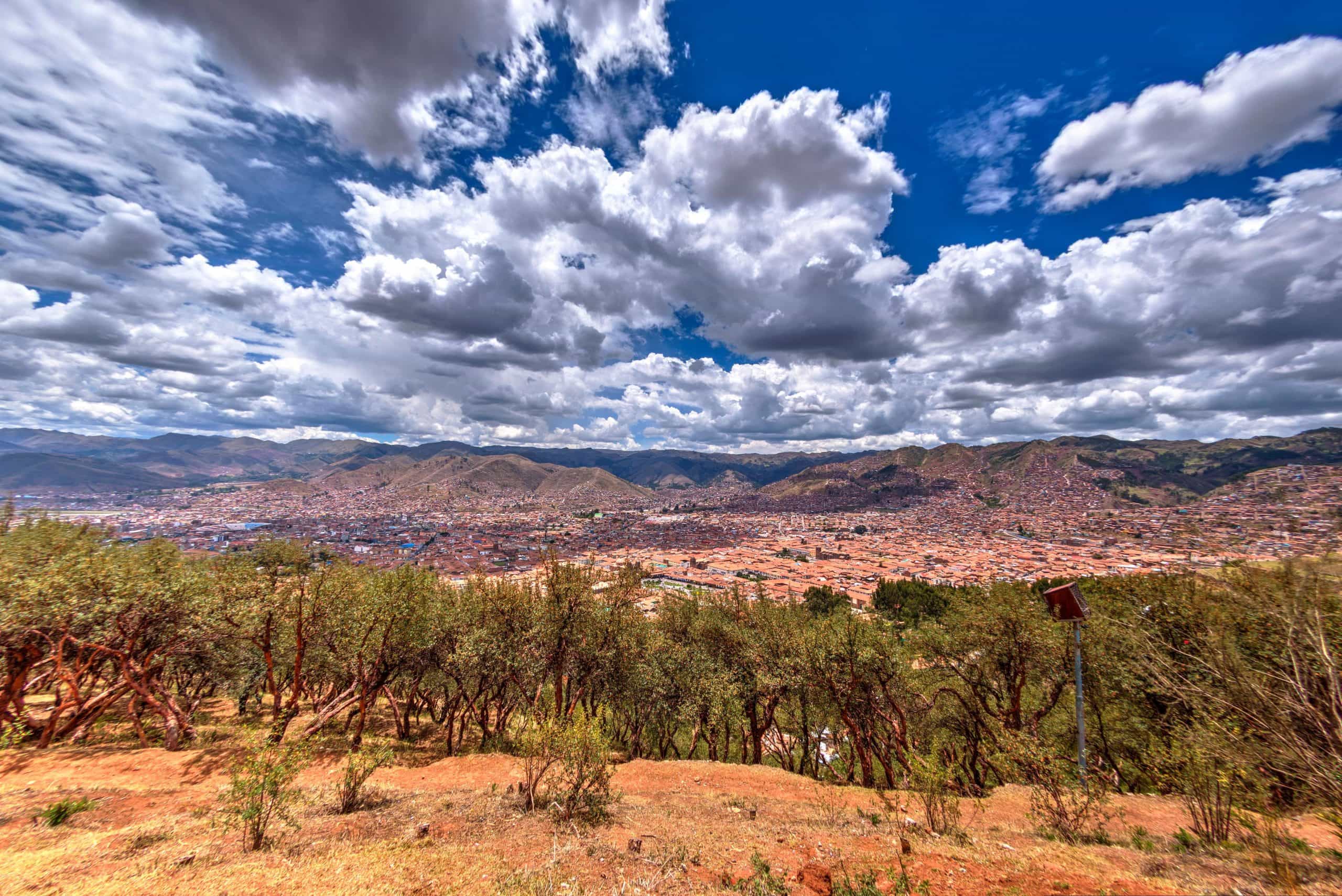 A view of the city of cusco from the top of a hill.