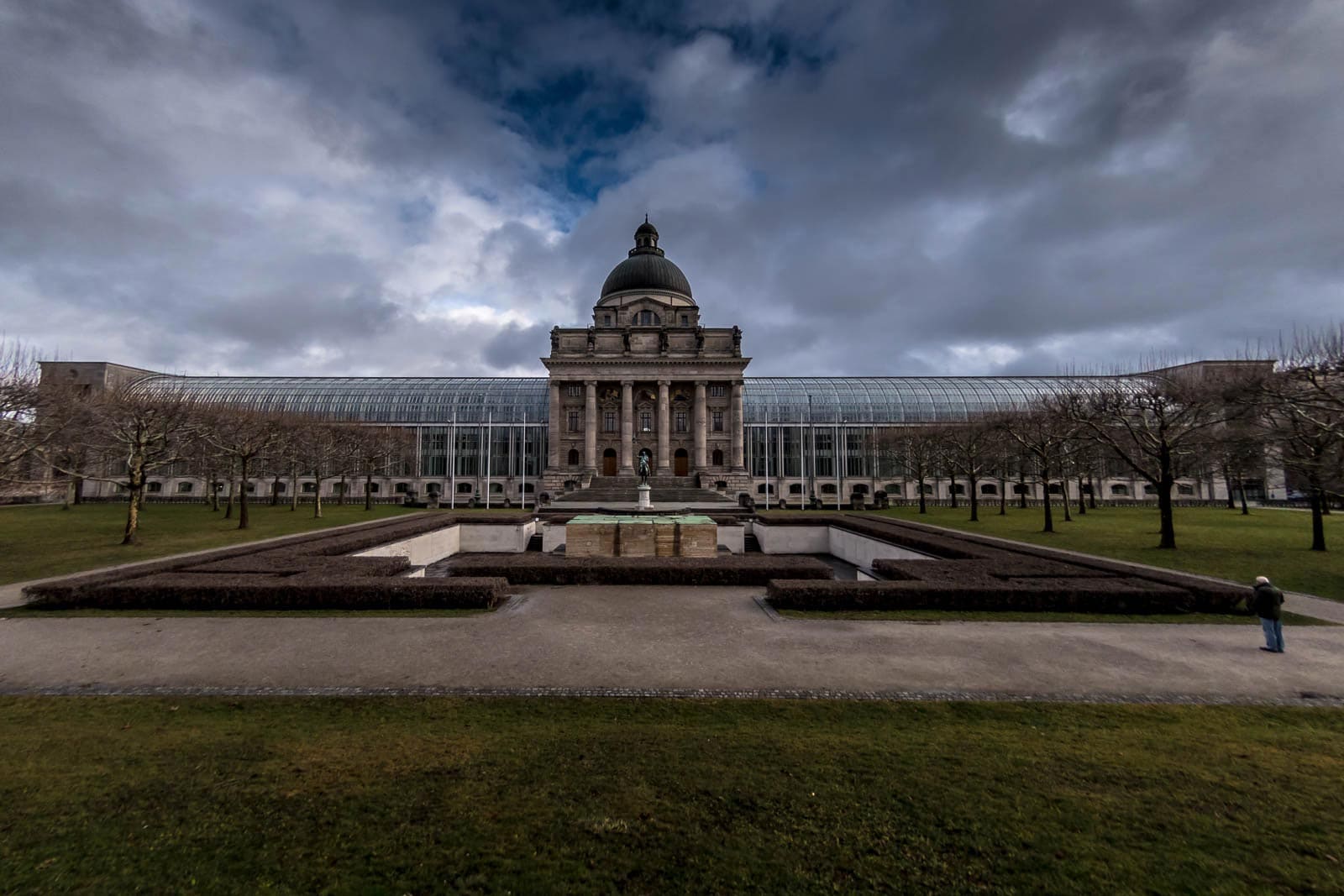 A large building with a fountain in front of it.