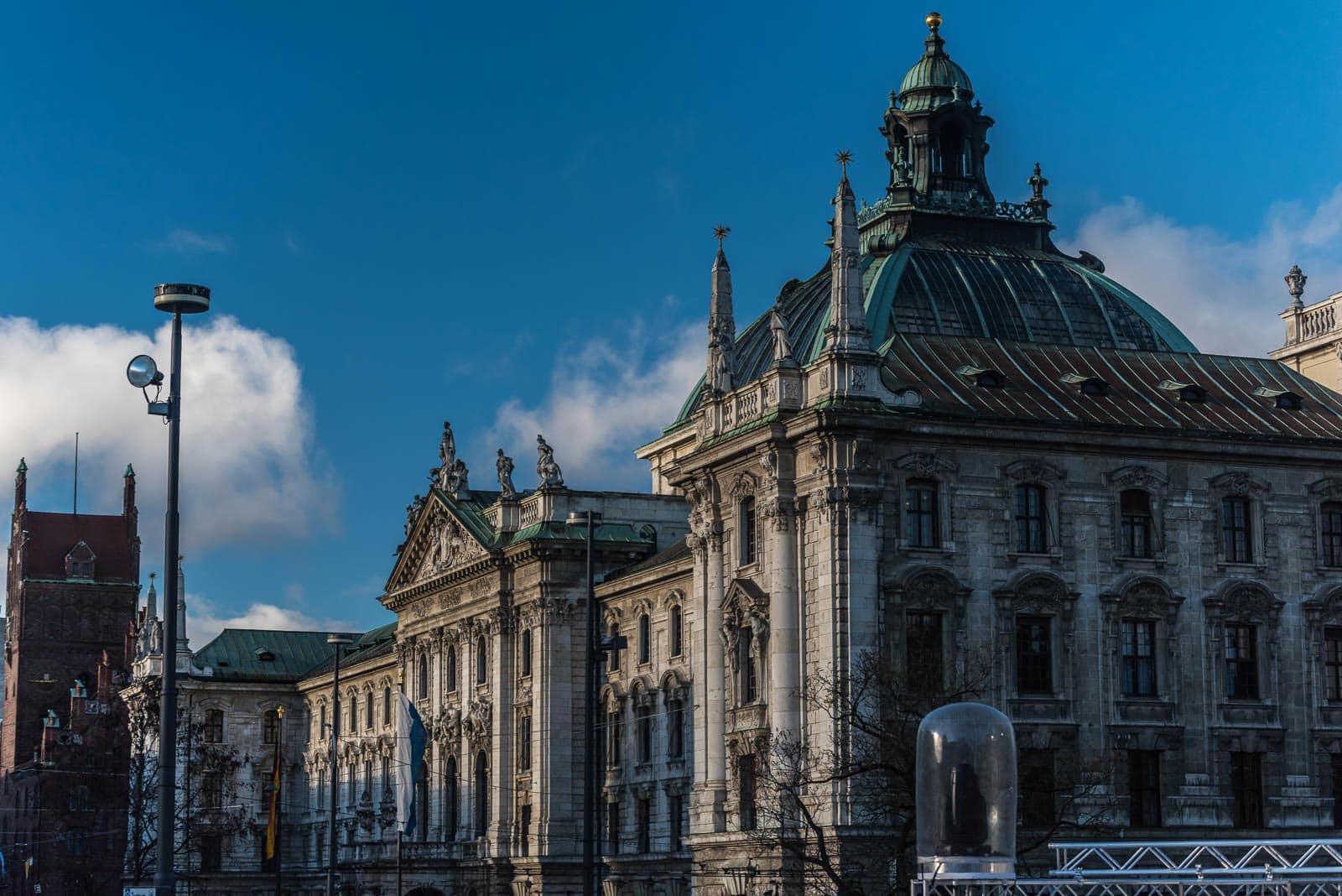 An ornate building with a clock tower in the background.