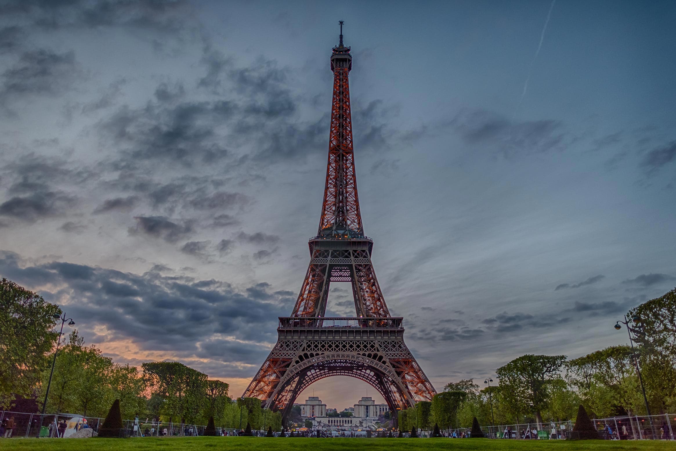 The eiffel tower in paris at sunset.