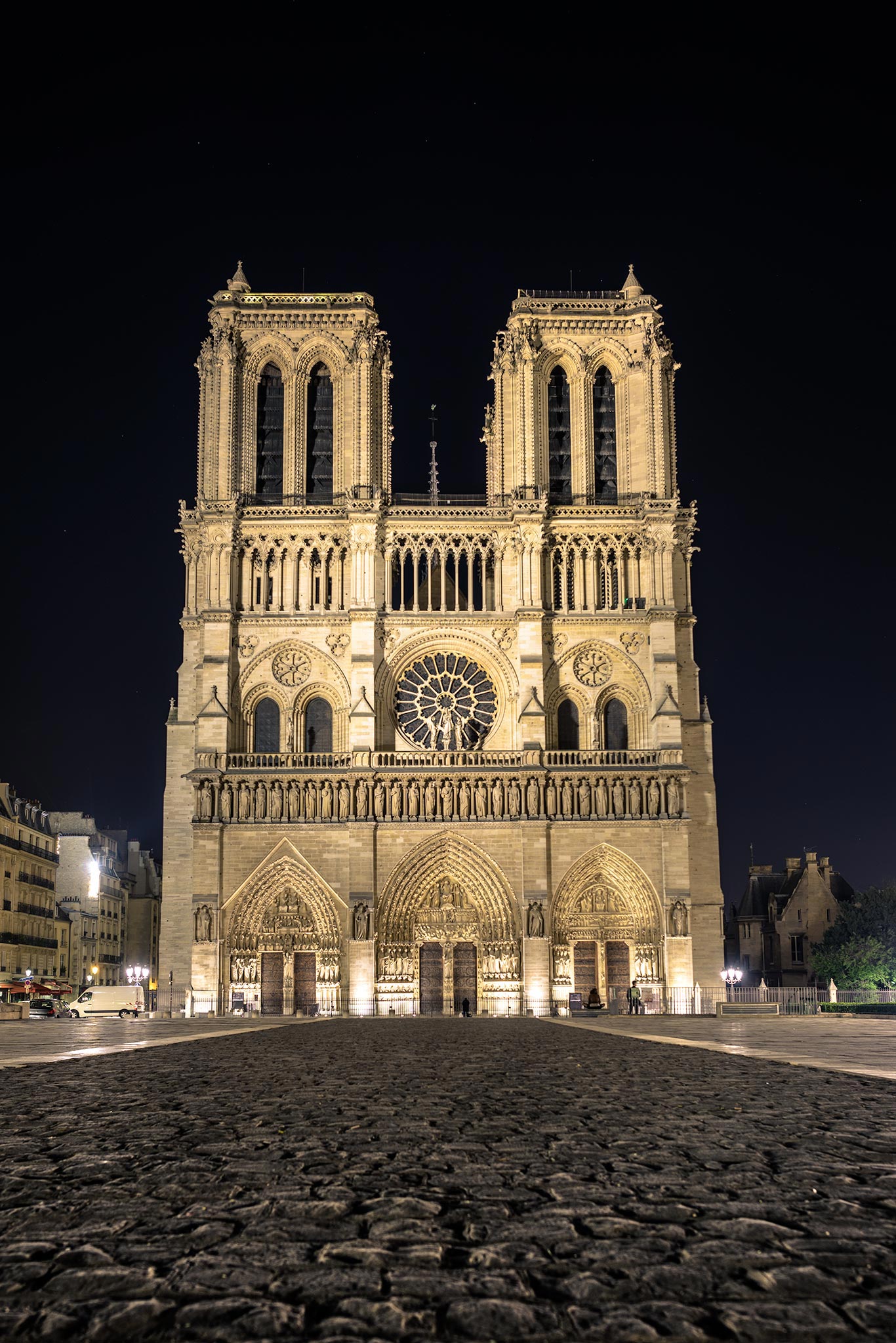 A large cathedral lit up at night.