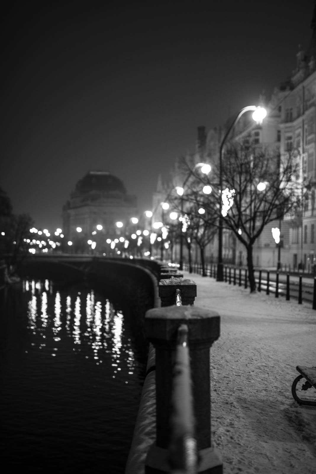 A black and white photo of a city at night.