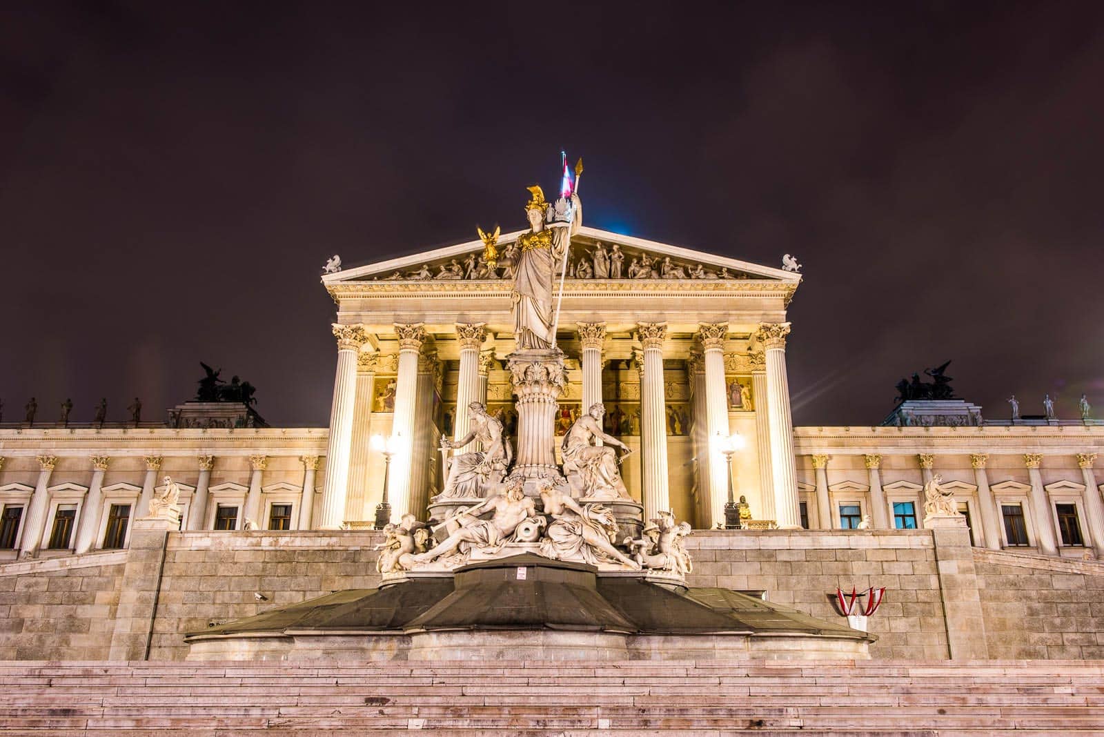 The parliament building in vienna at night.