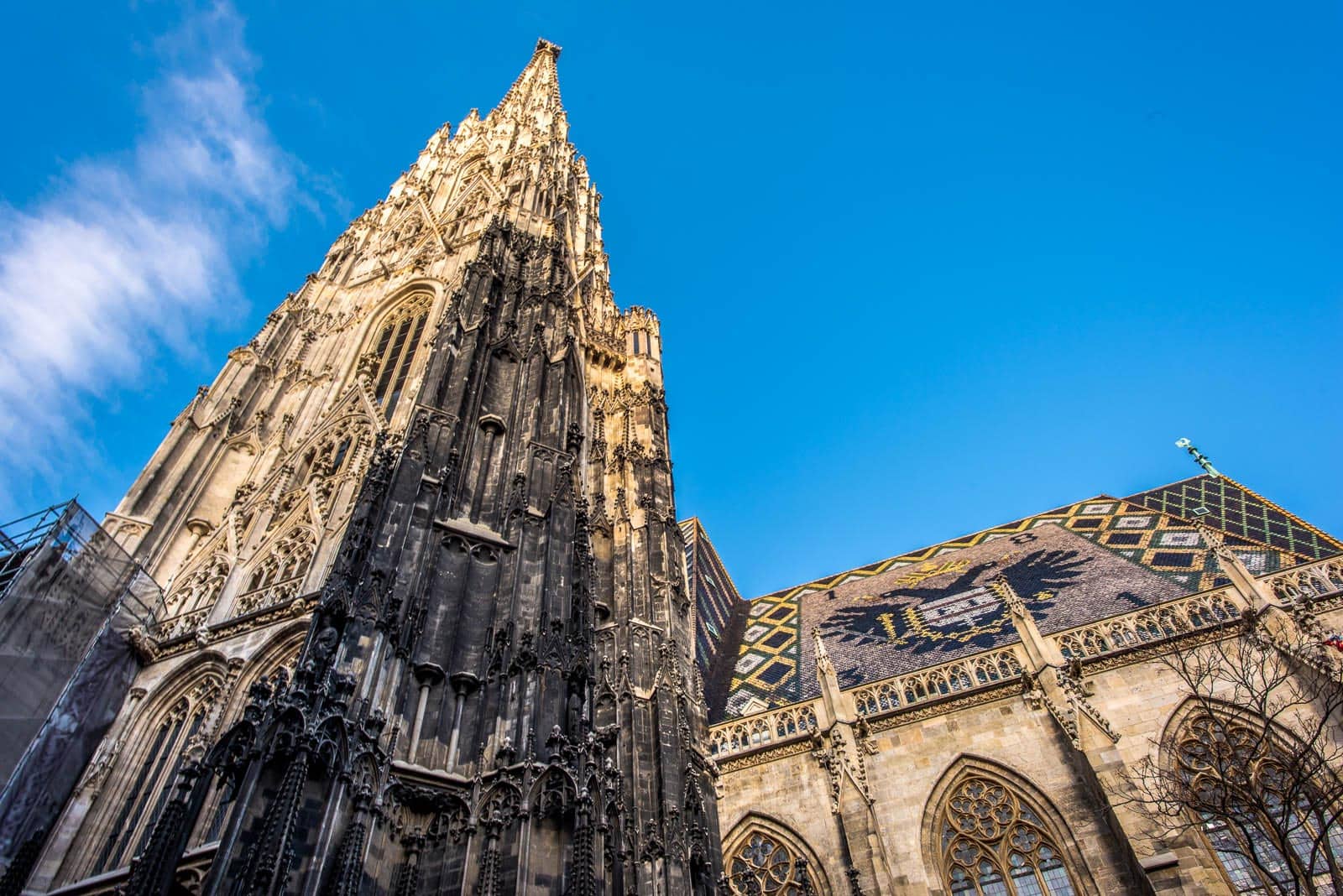 The spire of a cathedral against a blue sky.