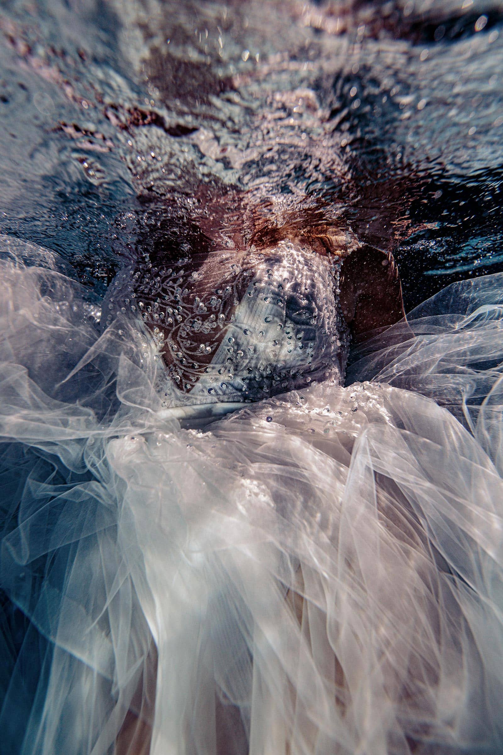 beautiful dress floats as the bubbles raise