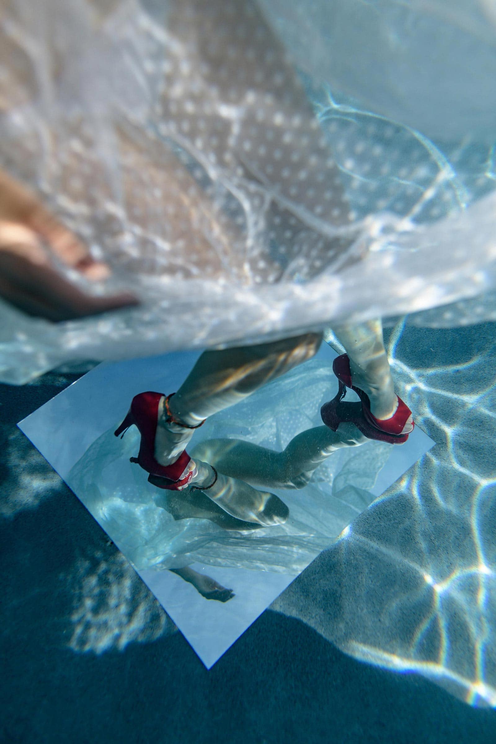 Red shoes and mirrors underwater look amazing