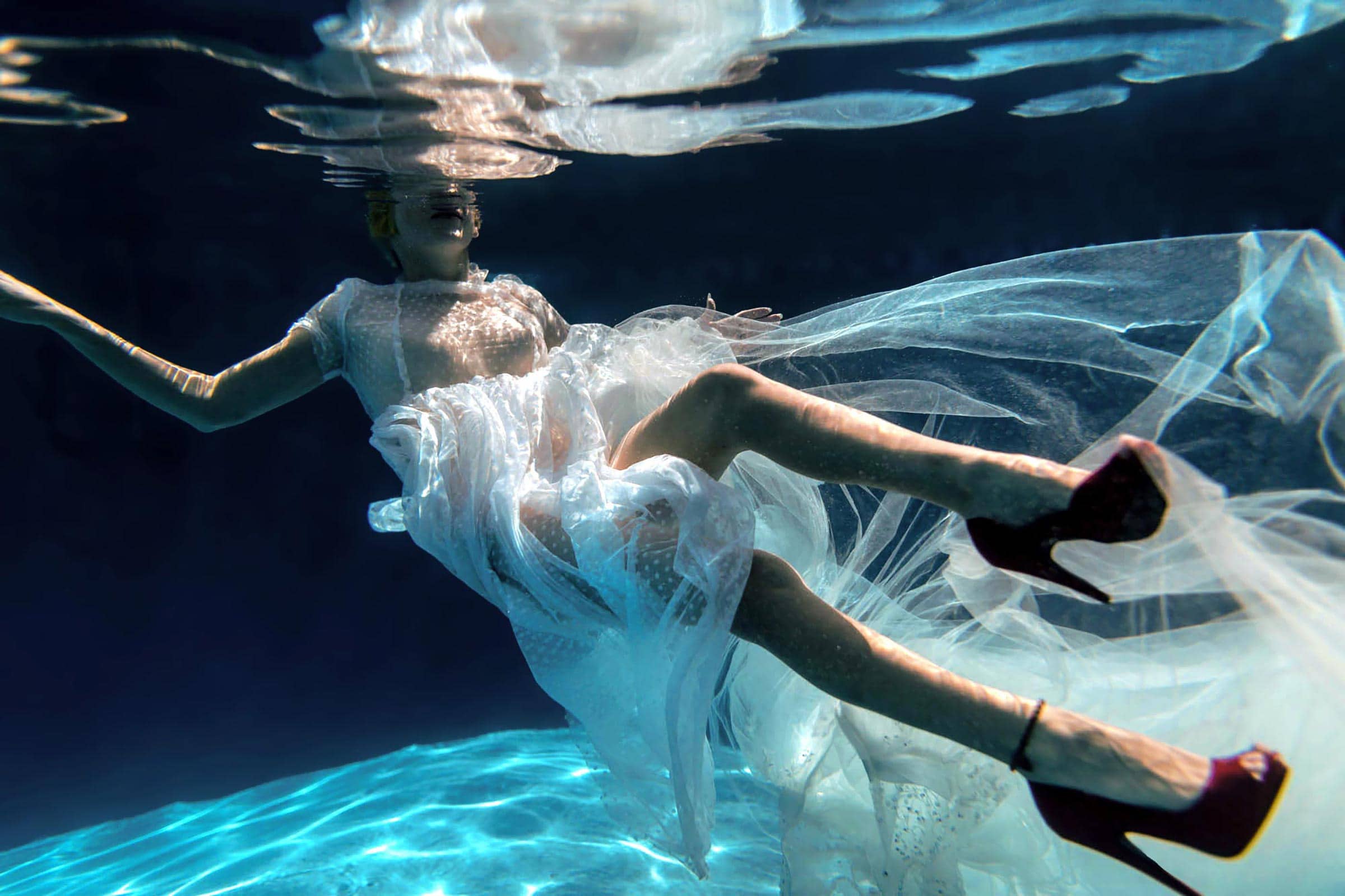 red shoes floating with a sheer dress