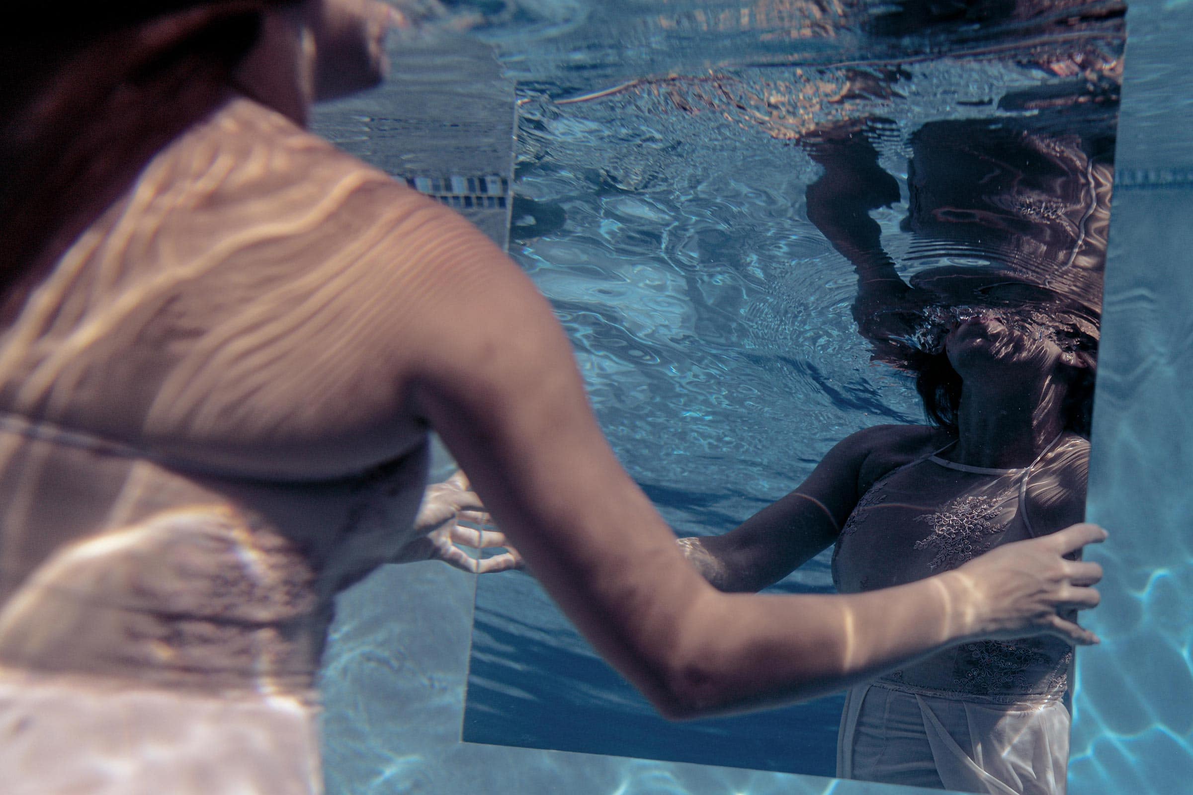 a reflection in a mirror under water