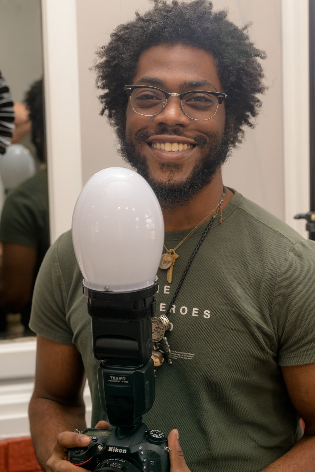 A man holding a light bulb.