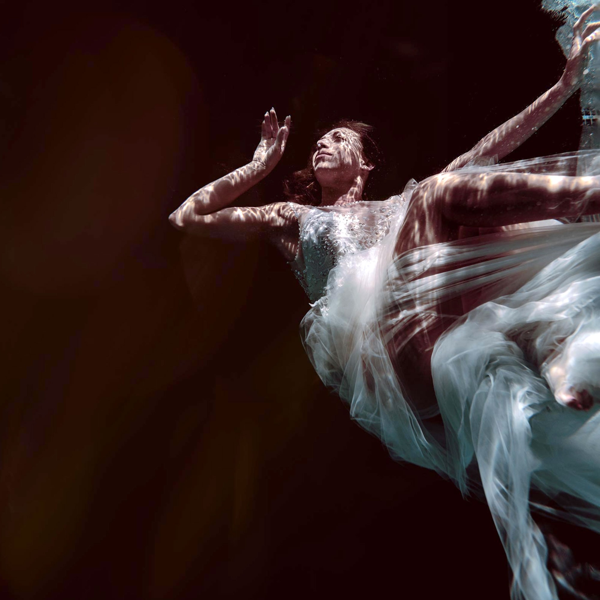 Moody wedding dress underwater dark