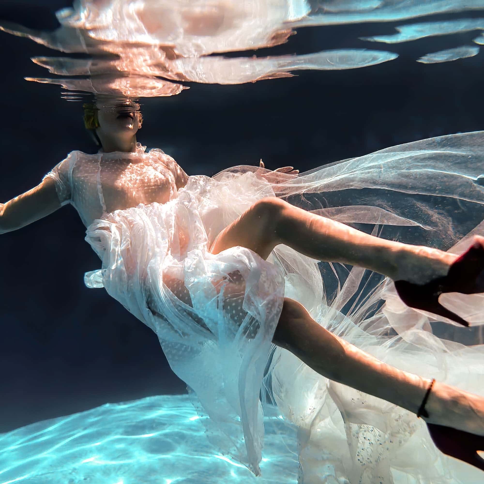 Moody wedding dress underwater dark