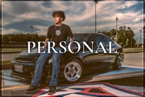 High school graduate poses with car