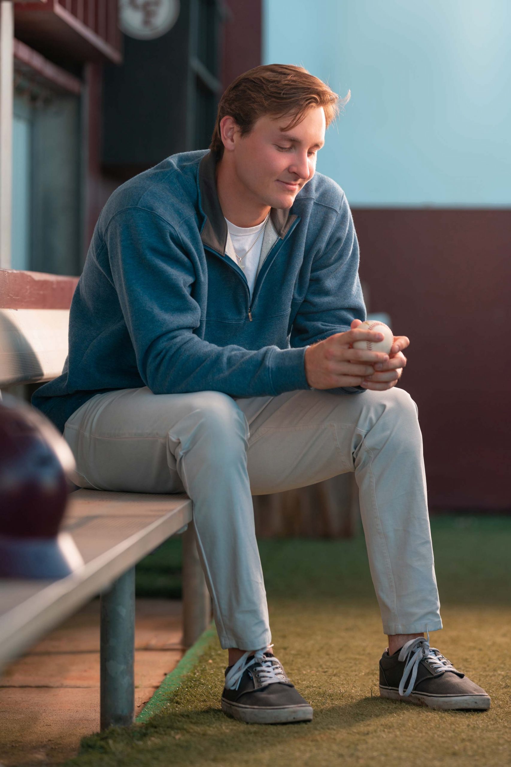 A man sitting on a bench engrossed with his phone captured by Houston Photographer, Chris Spicks Photography in a creatively composed snapshot.