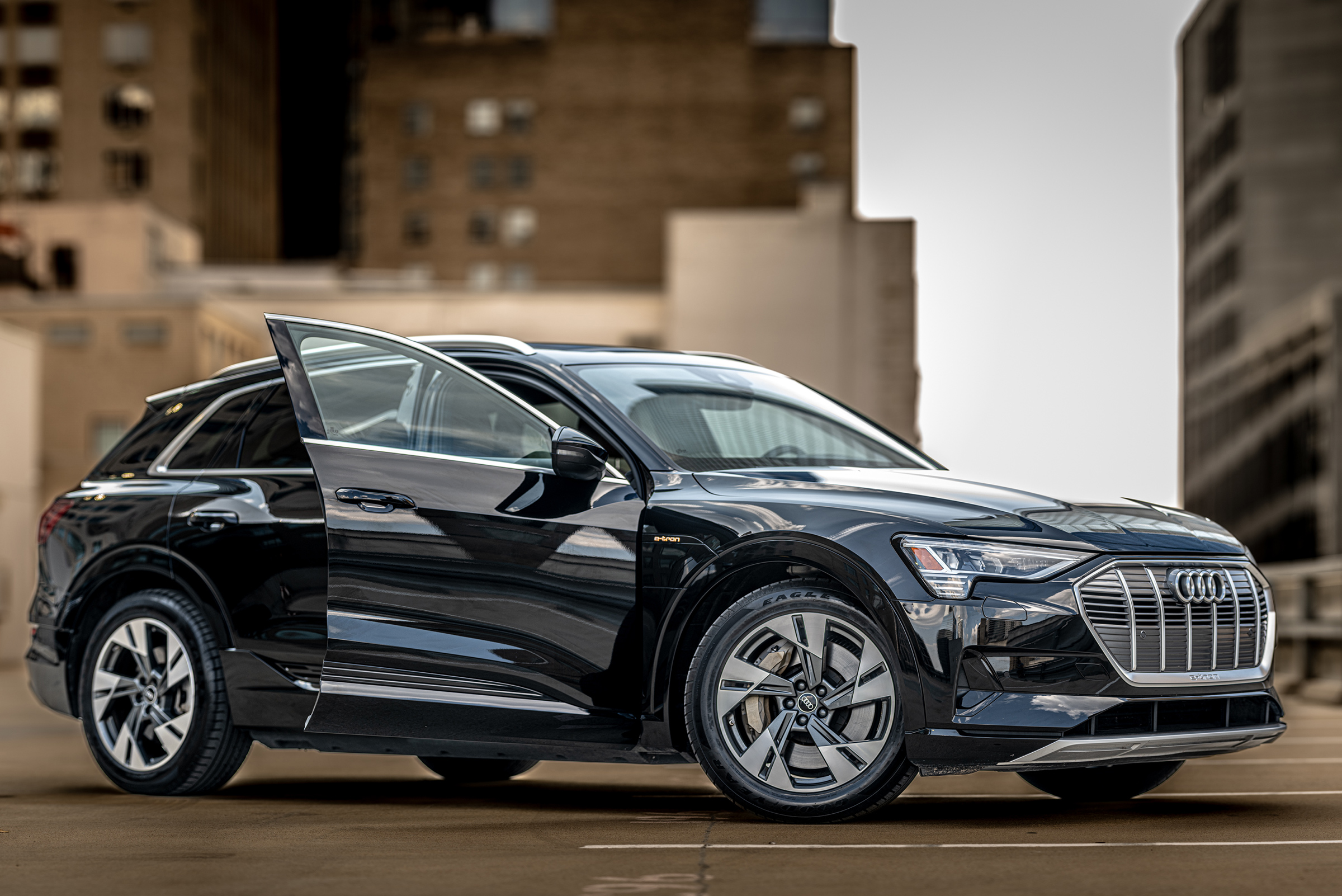 Beautiful Photography of an Audi E-tron Downtown Houston on a rooftop for sale, 