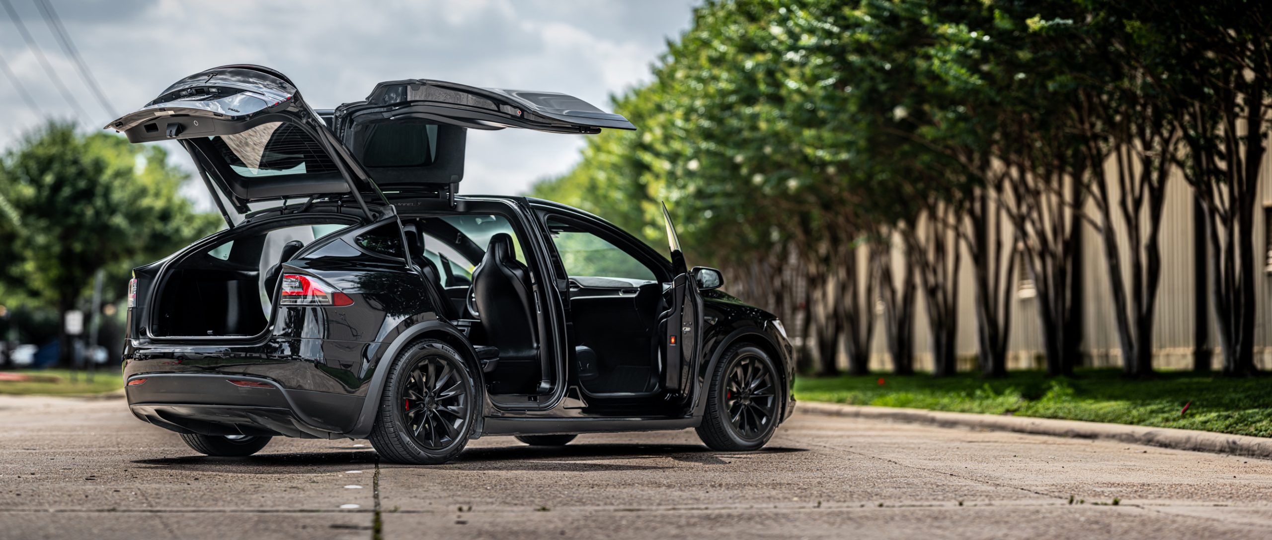 A black Tesla Model X with its trunk open captured by Houston Photographer, Chris Spicks Photography.